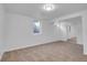 Finished basement area showcasing carpeting, a window, and a closet with mirrored doors at 1746 S Alcott St, Denver, CO 80219