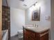 Bathroom featuring modern vanity, custom tile, and updated fixtures at 1746 S Alcott St, Denver, CO 80219