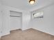 Cozy bedroom with carpet, standard closet, and window providing ample natural light at 1746 S Alcott St, Denver, CO 80219