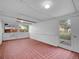Bright sun room with tile floors and a door leading to the outdoor space at 1746 S Alcott St, Denver, CO 80219