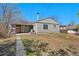 Wide backyard view featuring a patio and house at 640 S Quivas St, Denver, CO 80223