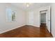 Bedroom featuring hardwood floors, ceiling fan and window at 640 S Quivas St, Denver, CO 80223