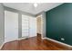 Bedroom with hardwood floors, and large closet at 640 S Quivas St, Denver, CO 80223