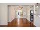 Dining room area leading to a living area and kitchen at 640 S Quivas St, Denver, CO 80223