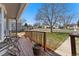 Relaxing front porch with chairs and a view of the neighborhood street at 640 S Quivas St, Denver, CO 80223