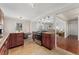 Traditional kitchen with cherry cabinets, granite countertops, stainless steel stove, adjacent dining and living area at 640 S Quivas St, Denver, CO 80223