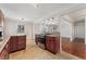 Traditional kitchen with cherry cabinets, granite countertops, stainless steel stove, and adjacent dining area at 640 S Quivas St, Denver, CO 80223