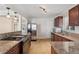 Modern kitchen featuring granite counters, stainless steel appliances, and tile flooring at 640 S Quivas St, Denver, CO 80223