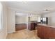 Bright kitchen with stainless steel appliances, granite countertops, and open layout at 640 S Quivas St, Denver, CO 80223