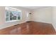 Bright living room with hardwood floors and a large window at 640 S Quivas St, Denver, CO 80223