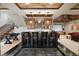 Finished basement features a wet bar, media area, and staircase at 1105 Northwood Ln, Castle Rock, CO 80108