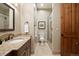 Bathroom featuring a vanity with granite counters and a glass-enclosed shower at 1105 Northwood Ln, Castle Rock, CO 80108