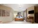 Cozy bedroom with wooden bed frame, TV, and stylish decor at 1105 Northwood Ln, Castle Rock, CO 80108