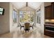 Charming breakfast nook with a round table, comfortable chairs, and large windows with scenic views at 1105 Northwood Ln, Castle Rock, CO 80108