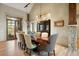 Beautiful dining area with hardwood floors, stylish lighting, and seamless access to the outdoor living space at 1105 Northwood Ln, Castle Rock, CO 80108