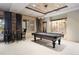 Game room featuring a pool table, bar-height seating, and modern lighting at 1105 Northwood Ln, Castle Rock, CO 80108