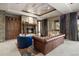 Comfortable living room with stone fireplace, wood cabinets, and a stylish leather sofa at 1105 Northwood Ln, Castle Rock, CO 80108