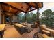 Inviting outdoor deck with comfortable seating, a wooden ceiling, scenic views, and a cozy ambiance at 1105 Northwood Ln, Castle Rock, CO 80108