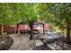 Inviting backyard patio featuring comfortable seating under a shaded gazebo, adjacent to an outdoor dining table at 2746 Geneva St, Denver, CO 80238