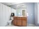 Neutral bathroom featuring vanity with sink, framed mirror, and combined shower and bathtub at 2746 Geneva St, Denver, CO 80238