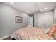 Simple bedroom with recessed lighting, closet, and comfy bed with pattern-printed comforter and pillows at 2746 Geneva St, Denver, CO 80238