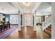 Spacious foyer with hardwood floors leading to living areas and dining room at 2746 Geneva St, Denver, CO 80238