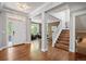 Inviting foyer with hardwood floors and staircase at 2746 Geneva St, Denver, CO 80238