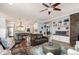 Bright living room with an open floor plan, built-in shelving, and seamless flow to the kitchen and dining areas at 2746 Geneva St, Denver, CO 80238