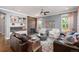 Cozy living room features a fireplace, built-in shelving, and comfortable seating arrangements at 2746 Geneva St, Denver, CO 80238
