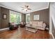 Comfortable living room with large windows and ceiling fan at 2746 Geneva St, Denver, CO 80238