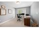Functional office space featuring modern desk, ergonomic chair, and natural light from the window at 2746 Geneva St, Denver, CO 80238