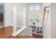 Bright staircase with white railings and large windows at 2746 Geneva St, Denver, CO 80238