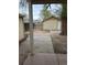 Backyard featuring a shed with a door and a concrete patio area at 325 N 7Th Ave, Brighton, CO 80601