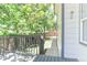 Gray painted deck looking out to tree line view and fenced yard at 19249 E Progress Ave, Centennial, CO 80015