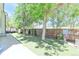 Lush backyard with artificial turf, framed by mature trees and wooden fencing; an outdoor oasis at 19249 E Progress Ave, Centennial, CO 80015