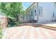 Paver patio and deck in backyard, surrounded by green space, creating an inviting outdoor living area at 19249 E Progress Ave, Centennial, CO 80015