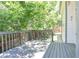 Gray painted deck with tree line view and fenced yard at 19249 E Progress Ave, Centennial, CO 80015