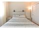 Comfortable bedroom features cozy bed with nightstands, wood-look flooring, and lots of light at 19249 E Progress Ave, Centennial, CO 80015