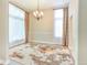 Elegant dining room with natural light, modern chandelier, large windows, and decorative rug at 19249 E Progress Ave, Centennial, CO 80015