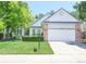 Charming single-Gathering home featuring a well-manicured lawn, brick accents, and a two-car garage at 19249 E Progress Ave, Centennial, CO 80015