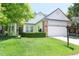 Charming single-Gathering home featuring a well-manicured lawn, brick accents, and a two-car garage at 19249 E Progress Ave, Centennial, CO 80015
