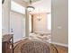 Inviting foyer with hardwood floors, chandelier, and views of the dining room at 19249 E Progress Ave, Centennial, CO 80015