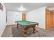 Basement game room features a pool table and carpet at 19249 E Progress Ave, Centennial, CO 80015