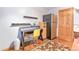 Home office with shelves, desk, and a refrigerator at 19249 E Progress Ave, Centennial, CO 80015