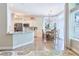 Bright kitchen featuring a breakfast bar, marble countertops, and ample storage space at 19249 E Progress Ave, Centennial, CO 80015
