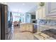 Open concept kitchen with granite countertops, stainless appliances, and adjoined breakfast nook at 19249 E Progress Ave, Centennial, CO 80015
