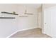 Bright living room features modern floating shelves and neutral walls at 19249 E Progress Ave, Centennial, CO 80015