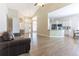 Open-concept living room and kitchen layout with vaulted ceilings and hardwood floors at 19249 E Progress Ave, Centennial, CO 80015