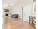 Bright living room features hardwood floors, vaulted ceilings and a cozy fireplace at 19249 E Progress Ave, Centennial, CO 80015