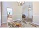 Open-concept space featuring hardwood floors, natural light, and views of the kitchen at 19249 E Progress Ave, Centennial, CO 80015